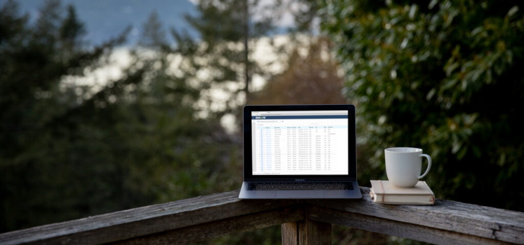 Laptop and coffee on balcony