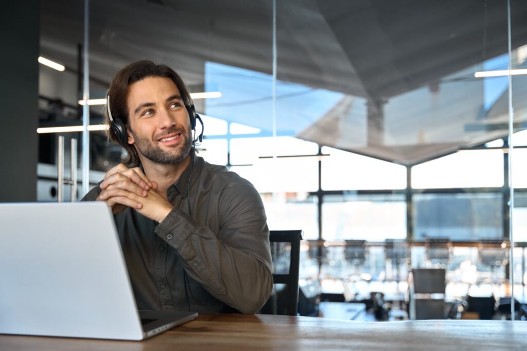 CFO reviewing customer experience ROI dashboard showing contact center investment returns and churn reduction metrics