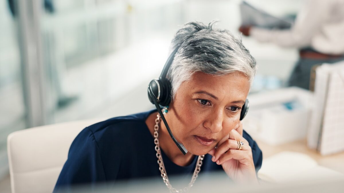 Contact center operations director reviewing a structured vendor evaluation scorecard for conversation analytics and AI QA platform selection across competing platforms