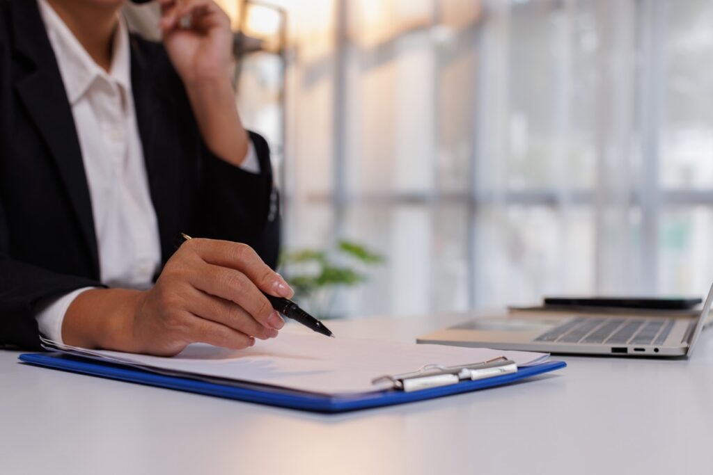 Contact center quality assurance manager reviewing the true cost breakdown of manual call sampling, supervisor hours, and compliance gaps compared to automated QA coverage