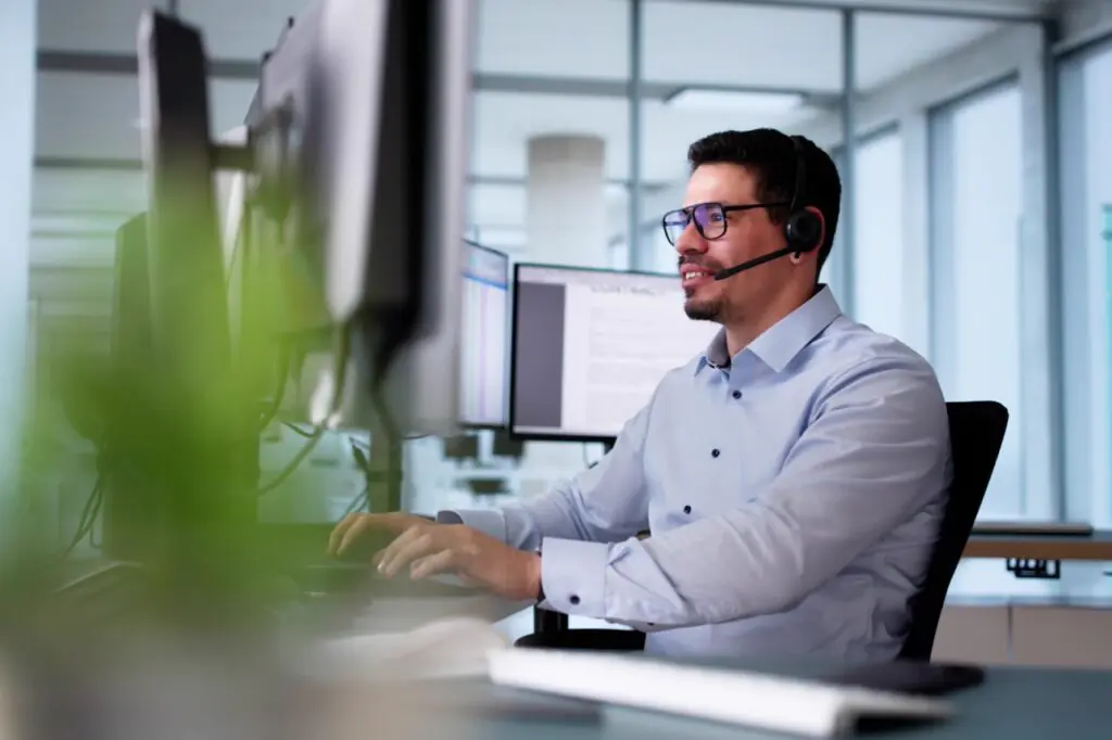 Contact center team working confidently during an overnight shift backed by 24/7 support coverage