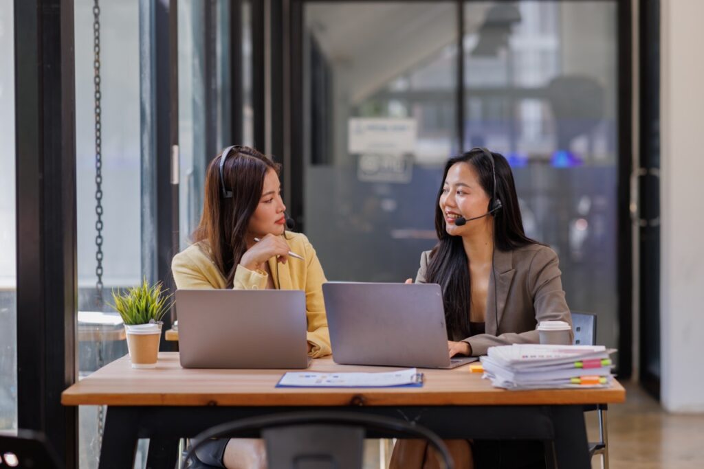 supervisor and agent reviewing call evidence together during a QA score dispute conversation