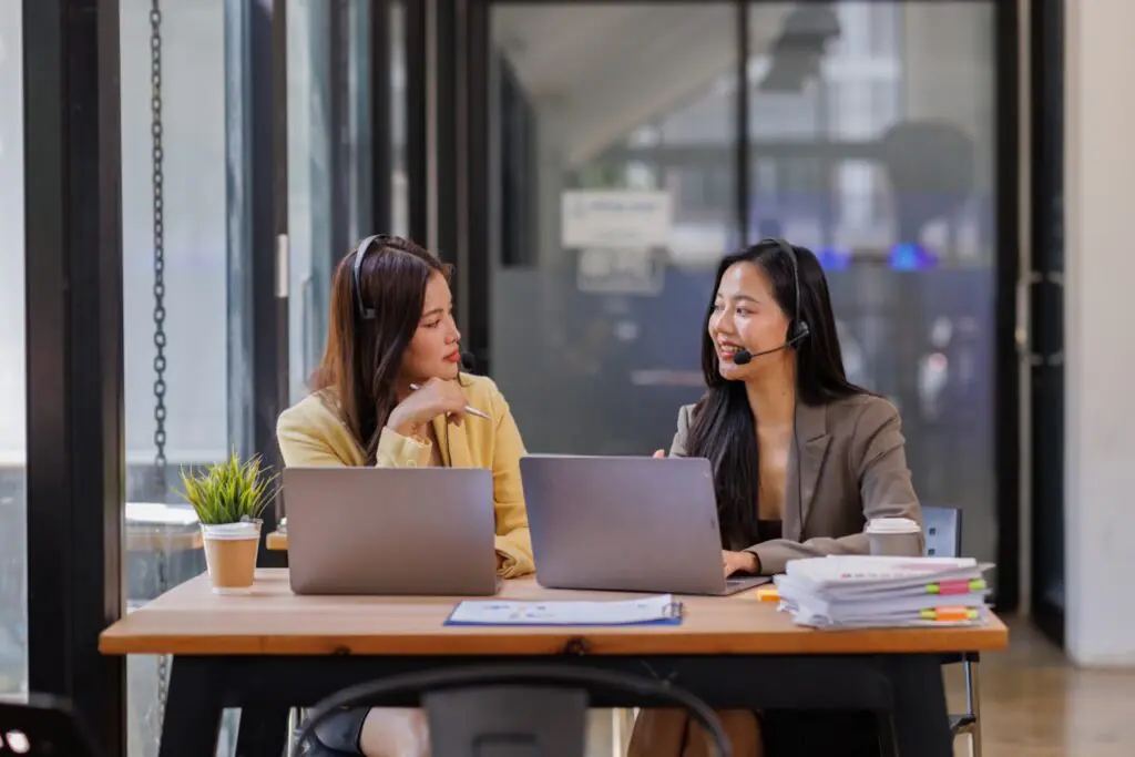 supervisor and agent reviewing call evidence together during a QA score dispute conversation