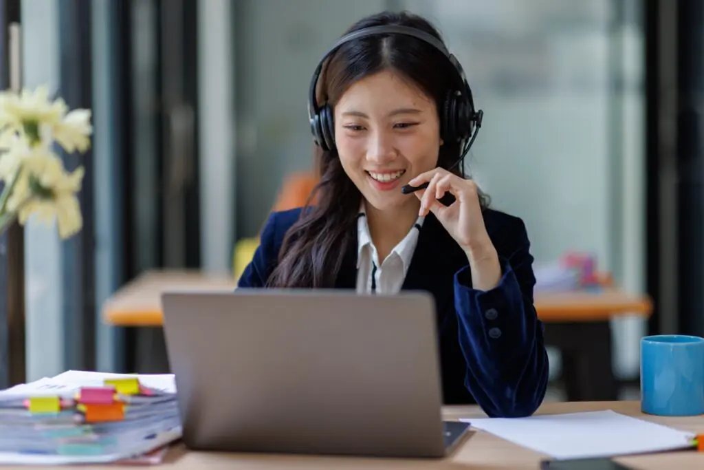 contact center leadership reviewing a full-coverage AI QA scoring business case presentation