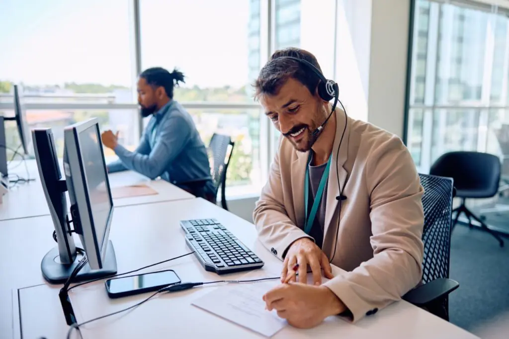 QA analyst reviewing trend data dashboard to spot early warning signals in contact center performance