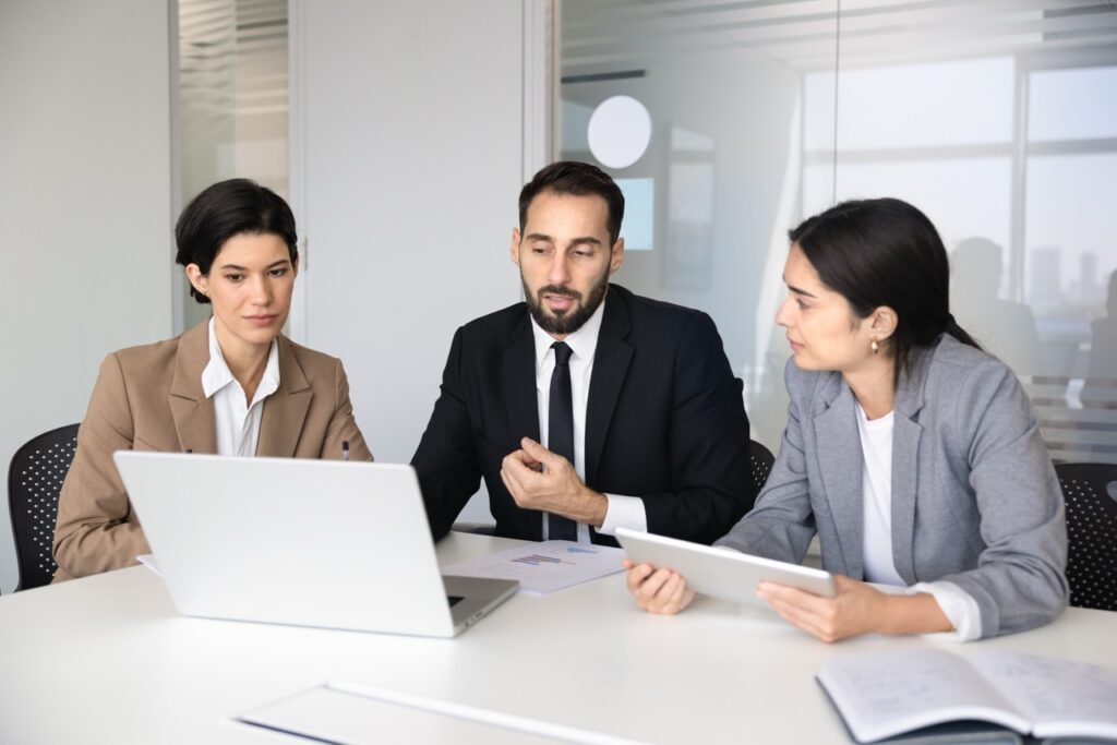 Contact center analyst reviewing a speech analytics ROI dashboard on a laptop