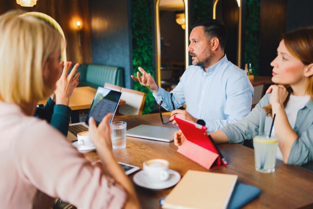 Small team meeting informally, showing the agility enterprise contact centers can learn from